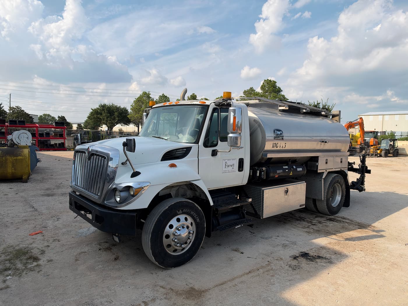 2014 International 7400 Etnyre Black Topper Centennial 2,000-gallon asphalt distributor — 3/4 front view — RoadKing Rentals Houston TX
